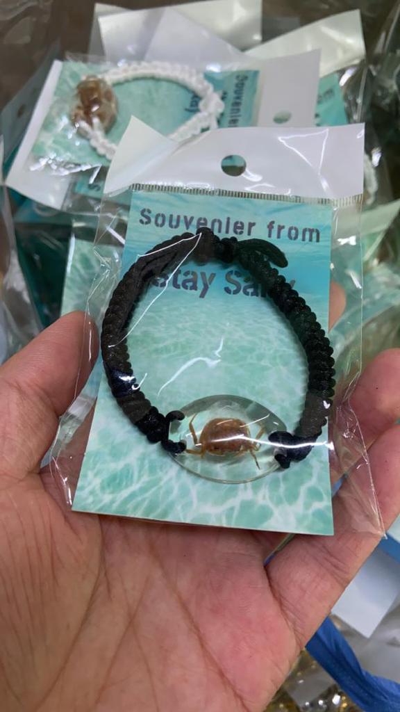 real CRAB melted into resin bracelet black cord