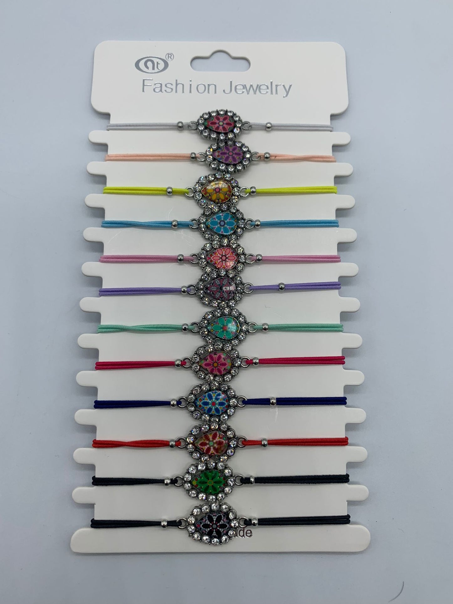 Pop of Color and Style with Our Colorful Cord Bracelets with Silver Colored Decorative Flower