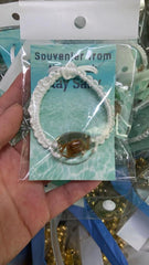 real CRAB melted into resin bracelet black cord